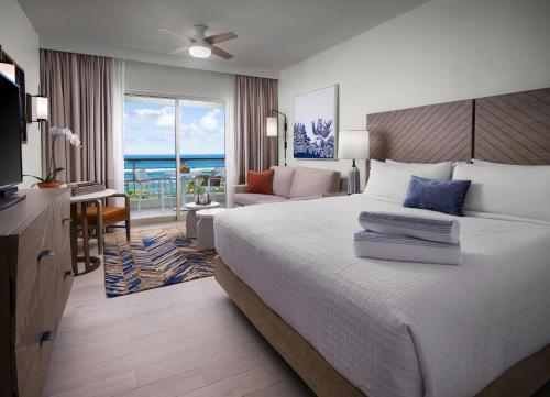 a bedroom with a bed and a view of the ocean at Hyatt Vacation Club at Hacienda del Mar in Dorado