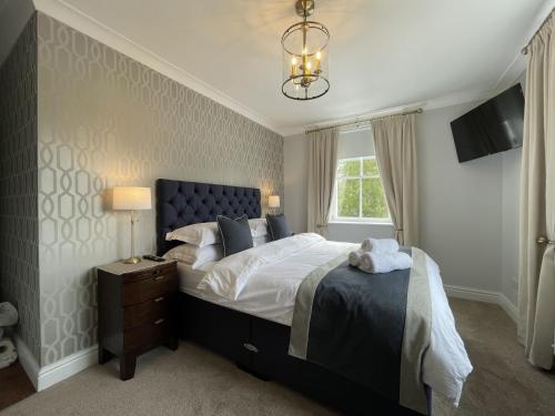 a bedroom with a large bed and a window at Park View in Keswick