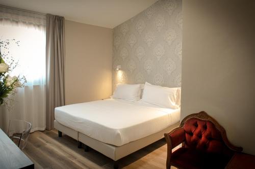 Postel nebo postele na pokoji v ubytování Hotel Della Rosa