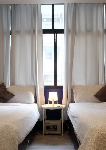 Ένα ή περισσότερα κρεβάτια σε δωμάτιο στο Sleep with Me Bangkok - BTS Phra Khanong