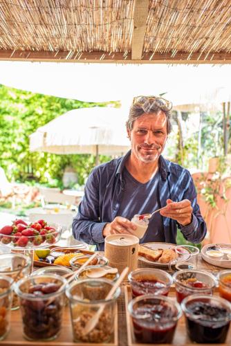 a man sitting at a table eating food at toctoctoc lisboa in Lisbon