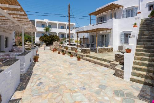 a stone walkway in front of a building at Ammos Sifnos Village in Platis Yialos Sifnos