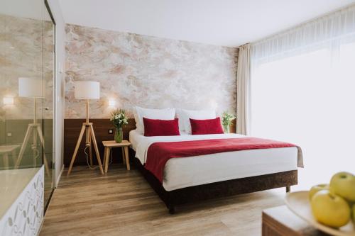 Postel nebo postele na pokoji v ubytování Hotel Terme Sveti Martin