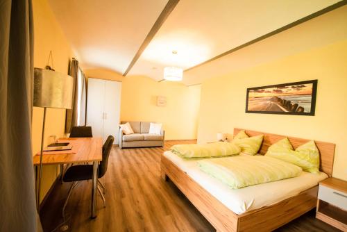 a bedroom with a bed and a desk in it at Mayr-Hof (Mank) in Seimetzbach