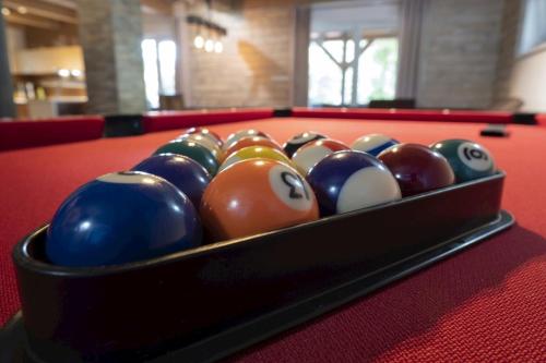 a tray of billiard balls on a pool table at Chata Emily in Smižany
