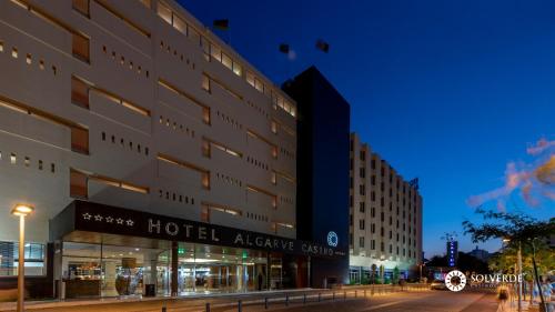 a hotel exterior at night with a street at Algarve Casino Hotel in Portimão