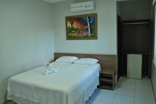 A bed or beds in a room at Pousada Lagoa Seca