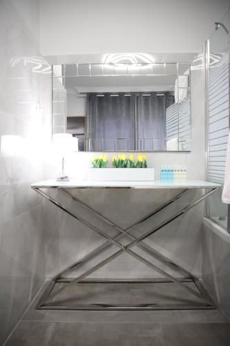 a kitchen with a counter with plants in it at Miami Beach Hotel Tel Aviv in Tel Aviv