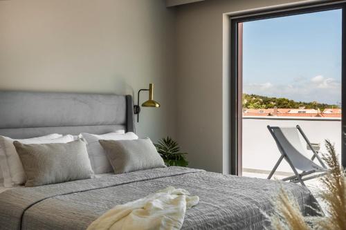Ένα ή περισσότερα κρεβάτια σε δωμάτιο στο The Twelve Suites Collection