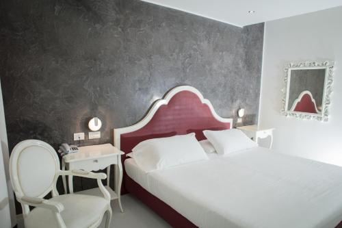 Ένα ή περισσότερα κρεβάτια σε δωμάτιο στο Blue Relais Maggiore