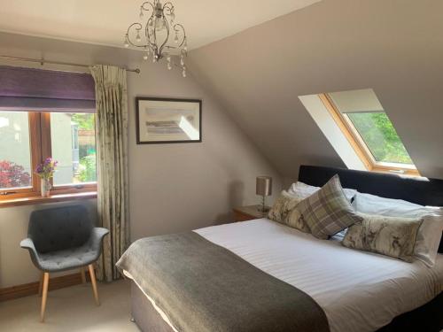 Un pat sau paturi într-o cameră la Inverasdale