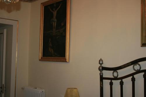 a painting on a wall with a picture on it at Palazzo Franza Musarò in Ugento