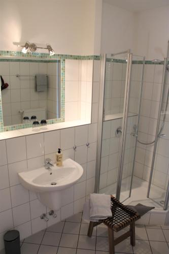 a bathroom with a sink and a shower at Gasthof Berghof in Presseck