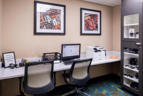 an office with a desk with a computer and two chairs at Candlewood Suites Paducah by IHG in Paducah