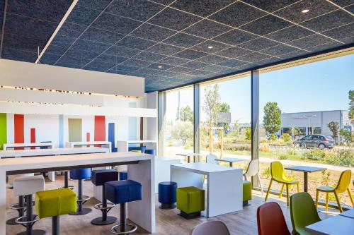 Restaurant ou autre lieu de restauration dans l'établissement Ibis Budget Montpellier Aéroport Parc Des Expos
