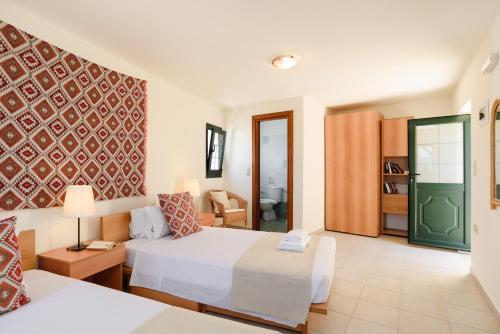 Giường trong phòng chung tại Villa Meitani