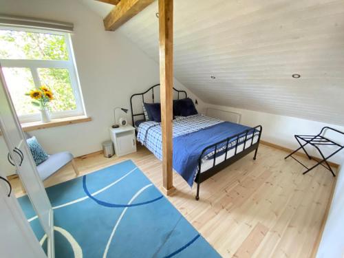 a bedroom with a bed in a attic at Eva in Liepāja