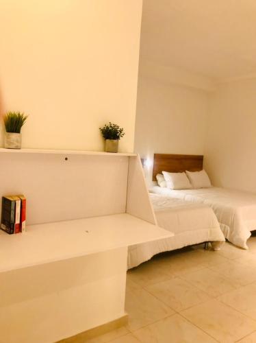 two beds in a room with two bedsvisor at Soy Local Primavera in Medellín