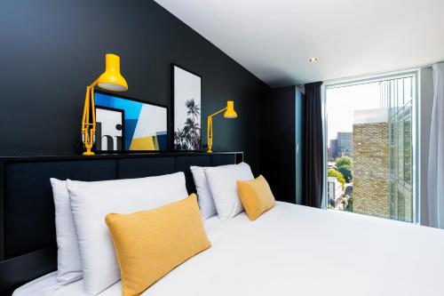 a hotel room with a bed and a television at Staycity Aparthotels Manchester Northern Quarter in Manchester