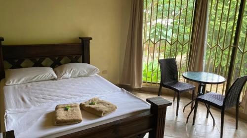Cama o camas de una habitación en Bahía Ballena Rooms