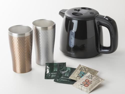 a tea kettle and a trash can and money at Grandvrio Hotel Miyajima Wakura - ROUTE INN HOTELS - in Miyajima