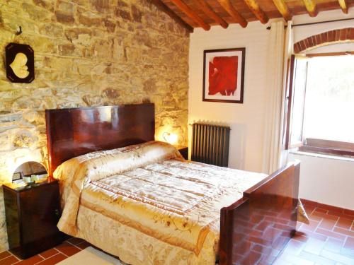 A bed or beds in a room at Podere Patrignone