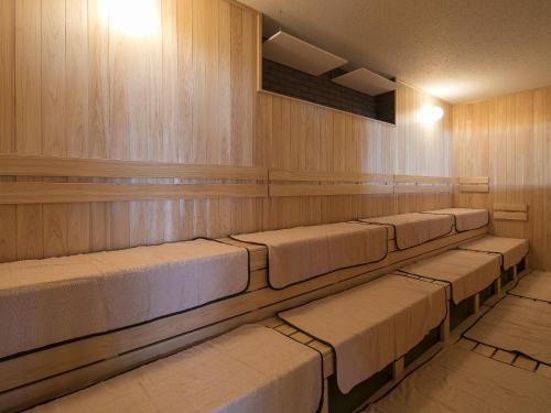 a row of seats in a lecture room at Grandvrio Hotel Miyajima Wakura - ROUTE INN HOTELS - in Miyajima