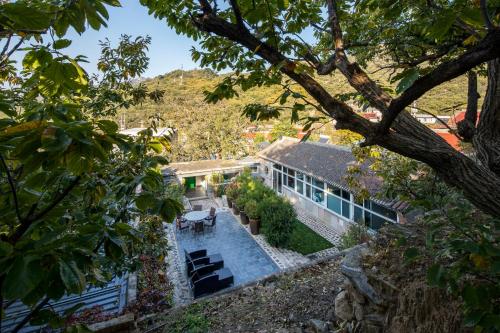 an aerial view of a house with a swimming pool at Brickyard Retreat at Mutianyu Great Wall Adjoin to Mutianyu Great Wall - Room with the View of Great Wall - Chinese massage experience - Vehicle Shuttle Service - International Catering - SPA& Nail Beauty Facilities in Huairou