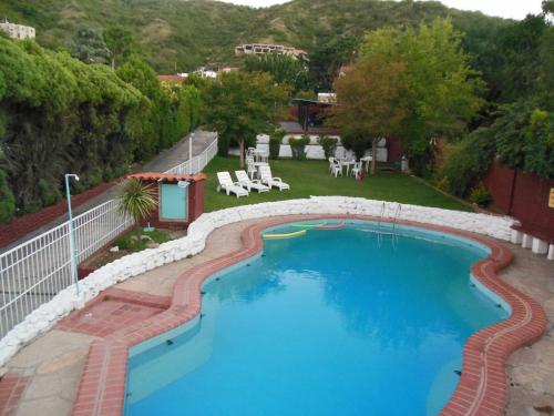 A view of the pool at Hotel Aoma Villa Carlos Paz or nearby