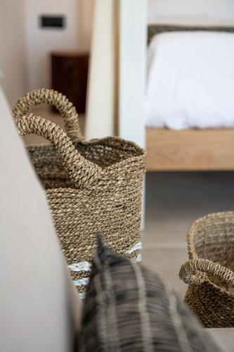 Ένα ή περισσότερα κρεβάτια σε δωμάτιο στο Athina Milos Suites