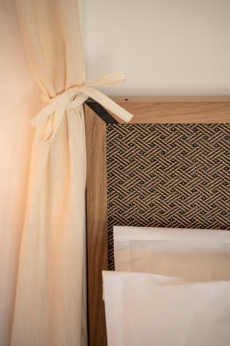 Ένα ή περισσότερα κρεβάτια σε δωμάτιο στο Athina Milos Suites