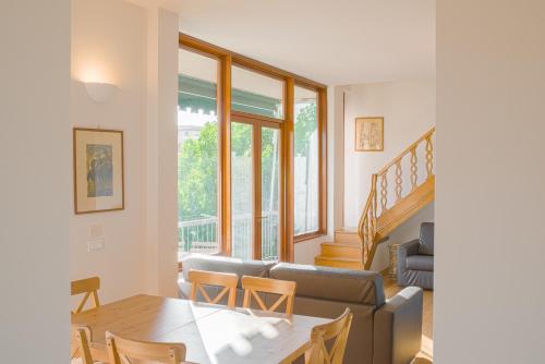 a living room with a couch and a table at Apartments Florence - Pier Capponi Duomo in Florence