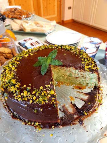 a chocolate cake on a plate on a table at Antico Casale Il Sambuco in Manduria