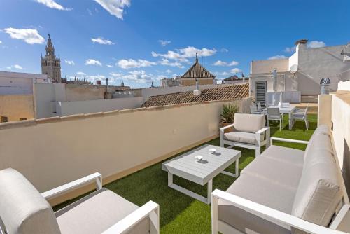 En balkon eller terrasse på Genteel Home Palacio Abades