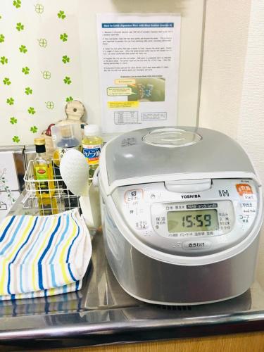 a scale sitting on top of a counter with food at Nikko Dream House in Nikko