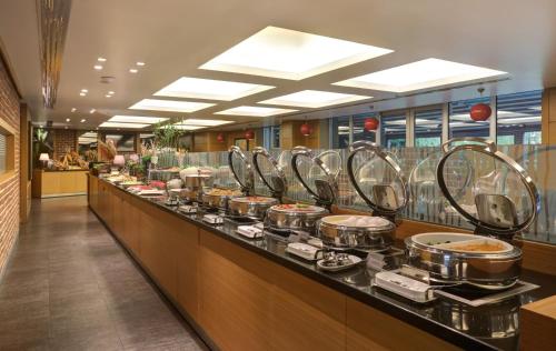 a buffet line with pots and pans of food at Divan Corlu in Corlu