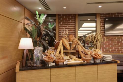 a counter with baskets of bread and other foods at Divan Corlu in Corlu