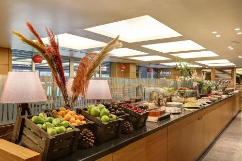a buffet line with fruits and vegetables on display at Divan Corlu in Corlu