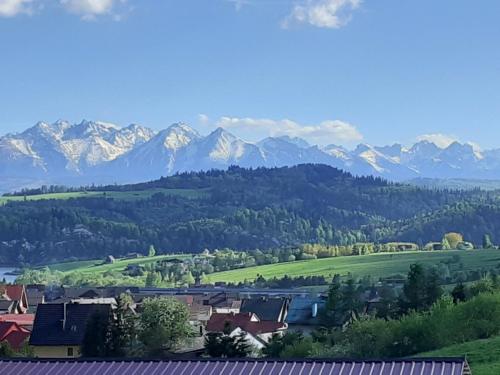 a town in a valley with mountains in the background at Dom Sosenek in Kluszkowce