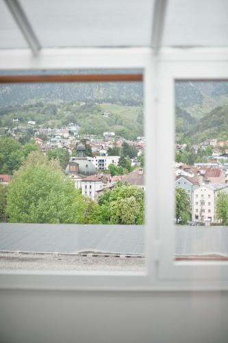 a view of a city from a window at Basic Hotel Innsbruck in Innsbruck