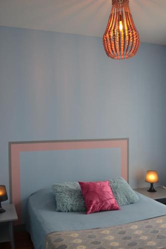 Ein Bett oder Betten in einem Zimmer der Unterkunft Atlantic Hôtel