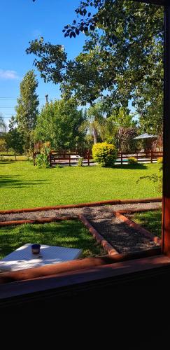 a view from a window of a park with a baseball field at Cabañas Pulmahue in Colón