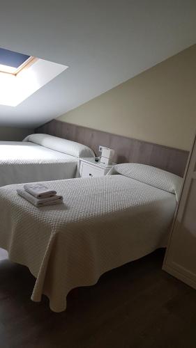 Łóżko lub łóżka w pokoju w obiekcie Hotel El Balcón