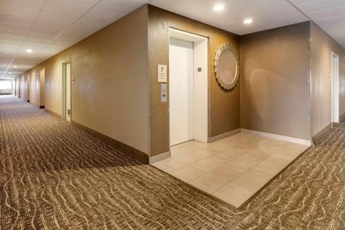 an empty hallway in a office building with a hallway at MainStay Suites Dubuque at Hwy 20 in Dubuque