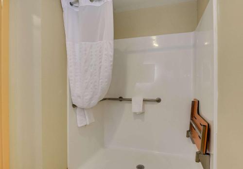 a bathroom with a toilet and a shower curtain at Comfort Inn & Suites Augusta Fort Eisenhower Area in Augusta
