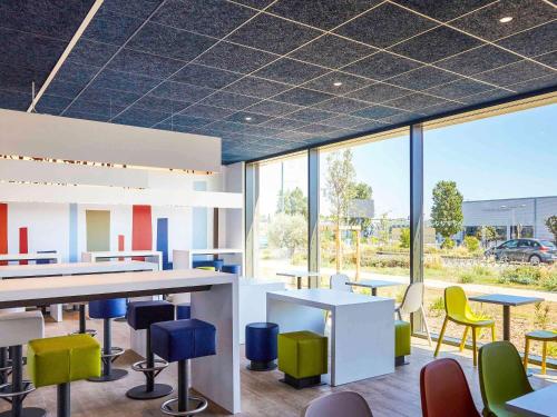 Restaurant ou autre lieu de restauration dans l'établissement Ibis Budget Montpellier Aéroport Parc Des Expos