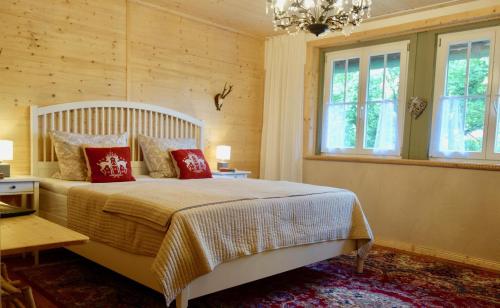 a bedroom with a large bed with red pillows at Zur Kanne für 3-4 Personen in Trichtingen