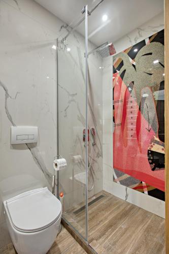 a bathroom with a toilet and a shower at OLD TOWN Apartments by Nejra in Sarajevo