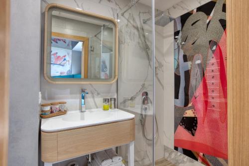 a bathroom with a sink and a mirror at OLD TOWN Apartments by Nejra in Sarajevo