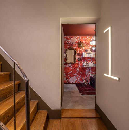 a hallway with stairs leading to a room at toctoctoc lisboa in Lisbon